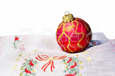 Red Christmas ball embroidered napkin isolated
