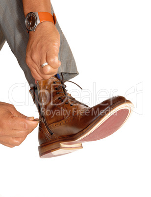 Man putting on his shoes.