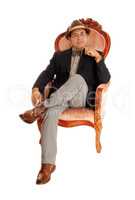 Hispanic man relaxing in a armchair.