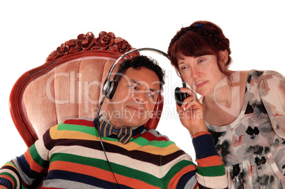 Husband and wife listening on headphone.