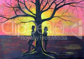 Love couple near a tree at sunset.