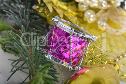 Christmas wreath with golden ornaments - new year drum, glass ball, Christmas present