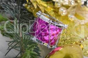 Christmas wreath with golden ornaments - new year drum, glass ball, Christmas present