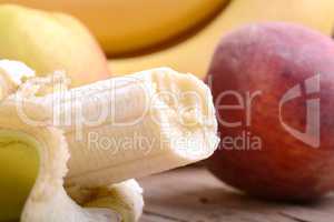 fruits on table, apple, bananas, peach close up, health food concept