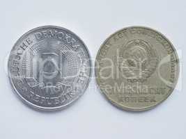 Vintage Russian ruble coin and German mark coin