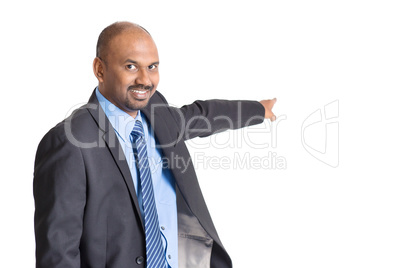 Indian businessman pointing away