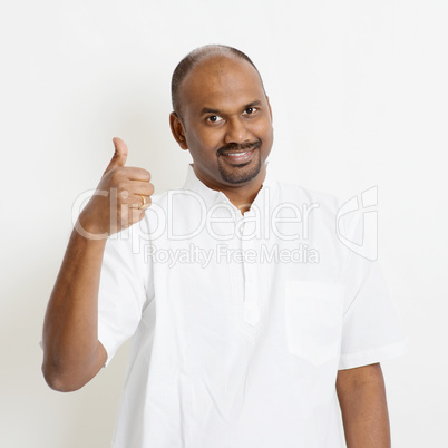 Casual mature Indian people thumb up