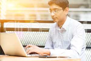 Indian businessman using laptop computer