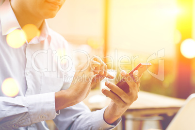 Business people, smartphone, laptop, sunset concept