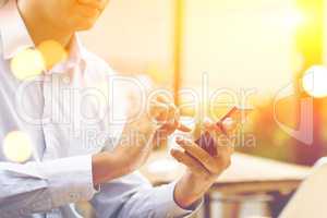 Business people, smartphone, laptop, sunset concept