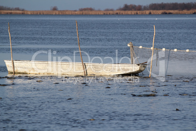 fishpond with boat and driftnet