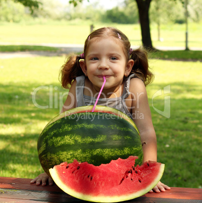 beauty little girl with watermelon summer scene