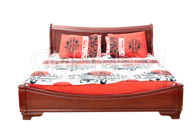 wooden bed with colorful linen