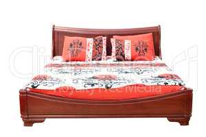 wooden bed with colorful linen