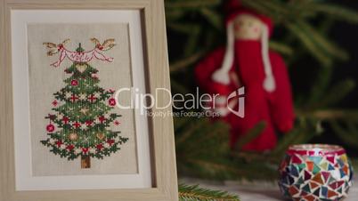 The cross stitch and Christmas toy