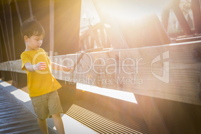 Handsome Mixed Race Boy Walking on Bridge