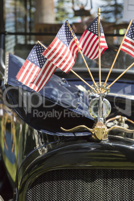 American Flags On Hood Ornament of Classic Car