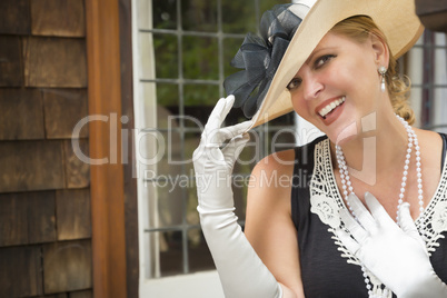 Attractive Woman in Twenties Outfit on Porch of Antique House