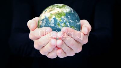 Earth in hands.