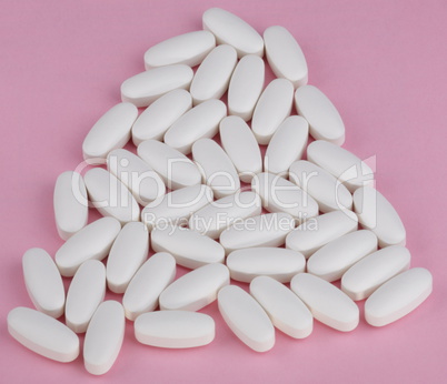 white pill on pink background