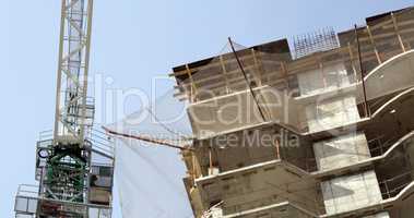 house develop with crane at day