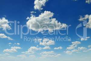 cumulus clouds in the blue sky