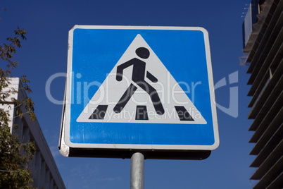 pedestrian crossing sign on street