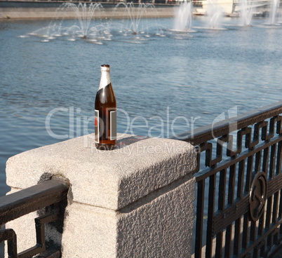 bottle on fence