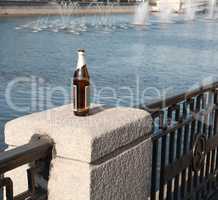 bottle on fence