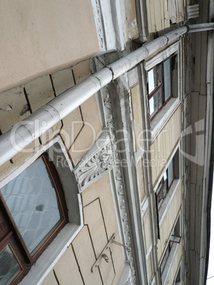 old yellow building with storm-down pipe