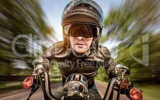 Biker racing on the road