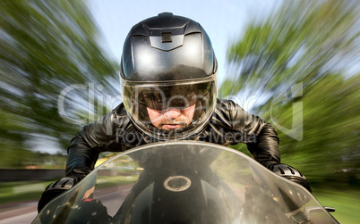 Biker racing on the road