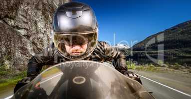 Biker racing on the road