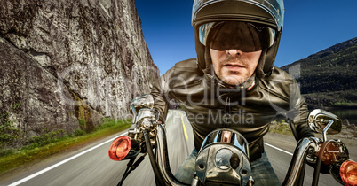 Biker racing on the road