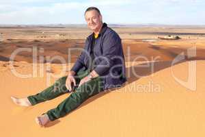 Man alone in the desert on the sand dune