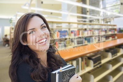 Mixed Race Girl With Books in the Library