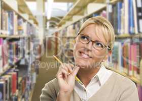 Woman with Pencil Looking to the Side in Library