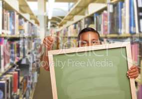 Hispanic Boy with Empty Chalk Board in Library