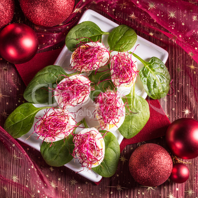 boiled eggs with red beet sprouts