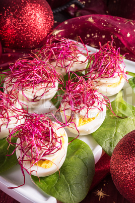 boiled eggs with red beet sprouts