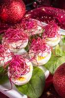 boiled eggs with red beet sprouts