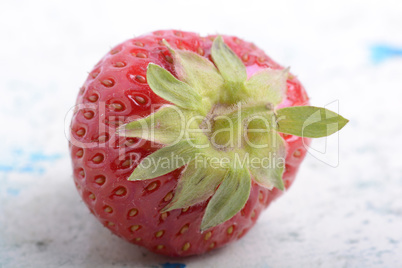 big fresh strawberry with green leave, close up