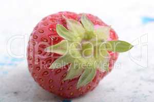 big fresh strawberry with green leave, close up