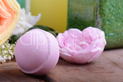 Spa theme with candles and flowers on wooden background