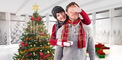 Composite image of woman giving man a present