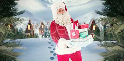 Composite image of father christmas holding many gifts