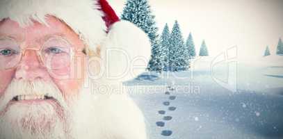 Composite image of santa claus is watching happy