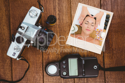 Composite image of smiling brunette enjoying a head massage