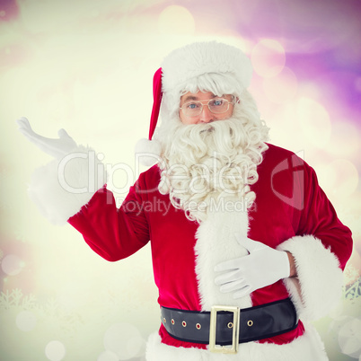 Composite image of happy santa with his hand out Composite image of happy santa with his hand out