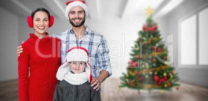 Composite image of happy family looking at camera